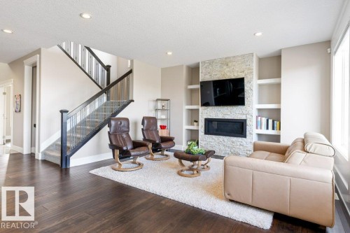 18 Executive Way, St. Albert, AB - Indoor Photo Showing Living Room With Fireplace