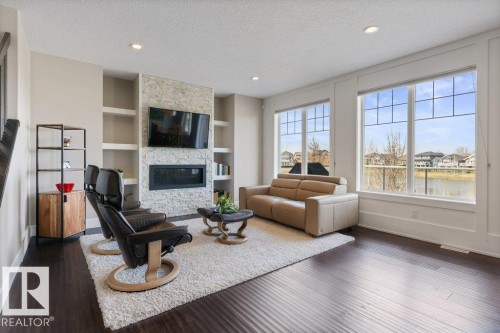 18 Executive Way, St. Albert, AB - Indoor Photo Showing Living Room With Fireplace