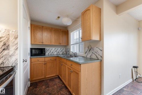 1044 Barnes Way, Edmonton, AB - Indoor Photo Showing Kitchen With Double Sink