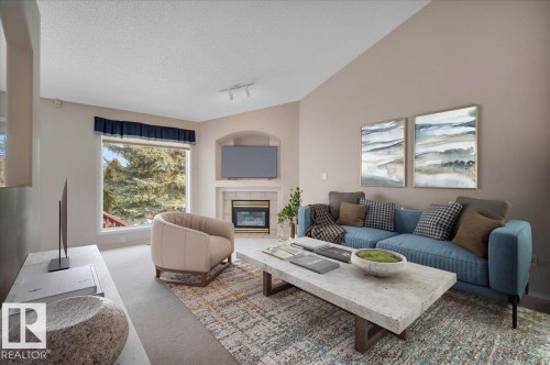 Virtually staged - 19 1203 Carter Crest Road, Edmonton, AB - Indoor Photo Showing Living Room With Fireplace