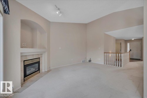 with a gas fireplace - 19 1203 Carter Crest Road, Edmonton, AB - Indoor With Fireplace