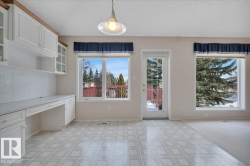 With a door opening onto the deck - 19 1203 Carter Crest Road, Edmonton, AB - Indoor Photo Showing Other Room