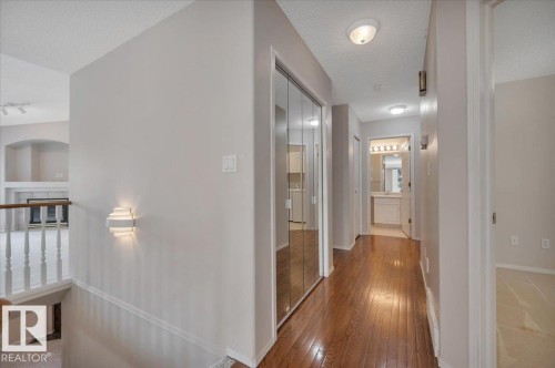 Hallway featuring hardwood flooring - 19 1203 Carter Crest Road, Edmonton, AB - Indoor Photo Showing Other Room