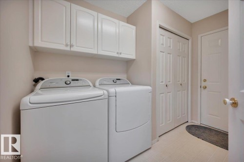Conveniently located on main floor with direct access to the garage. - 19 1203 Carter Crest Road, Edmonton, AB - Indoor Photo Showing Laundry Room