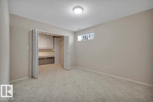 Huge walk-in closet with a built-in desk - 19 1203 Carter Crest Road, Edmonton, AB - Indoor