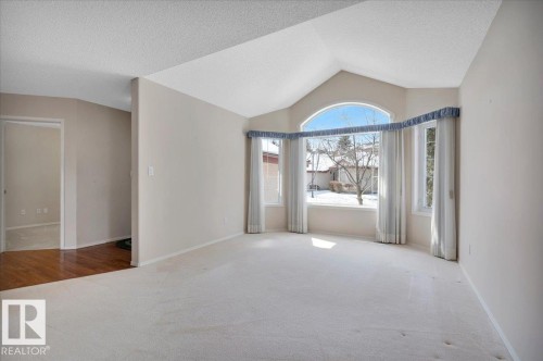 The living area features a vaulted ceiling - 19 1203 Carter Crest Road, Edmonton, AB - Indoor Photo Showing Other Room