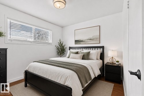 Bright room with a wide window featuring horizontal blinds - 13516 104A Street, Edmonton, AB - Indoor Photo Showing Bedroom
