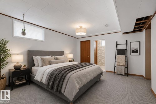Bedroom featuring light gray carpeting and white walls with wood trim - 13516 104A Street, Edmonton, AB - Indoor Photo Showing Bedroom