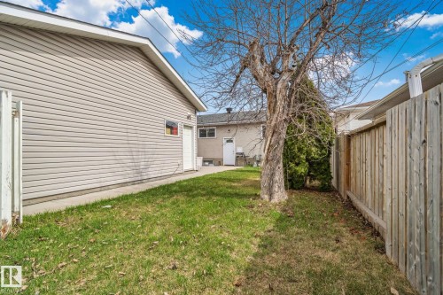 Detached garage with horizontal siding and a side entry door - 13516 104A Street, Edmonton, AB - Outdoor