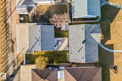 Aerial view showcasing multiple properties with shingle roofing, concrete driveways, and landscaped yards - 13516 104A Street, Edmonton, AB - Outdoor