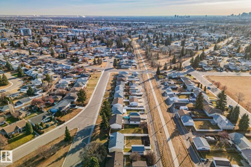 Residential area featuring an established street grid with mature trees, single-family homes, and open spaces - 13516 104A Street, Edmonton, AB - Outdoor With View