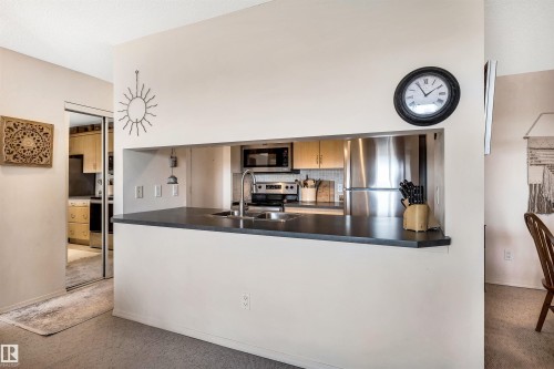 409 2430 Guardian Road, Edmonton, AB - Indoor Photo Showing Kitchen With Double Sink