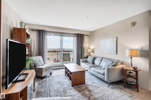 409 2430 Guardian Road, Edmonton, AB - Indoor Photo Showing Living Room
