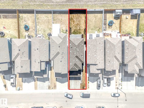 Aerial view highlighting property boundaries, a residential structure with a gabled roof, and an undeveloped rear yard - 2435 12 Avenue, Edmonton, AB - Other