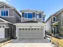 Two-story home with light grey siding and a dark grey accent panel - 2435 12 Avenue, Edmonton, AB  - Outdoor With Facade 