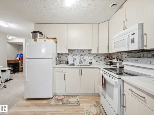 Image quality insufficient for description - 2435 12 Avenue, Edmonton, AB - Indoor Photo Showing Kitchen With Double Sink