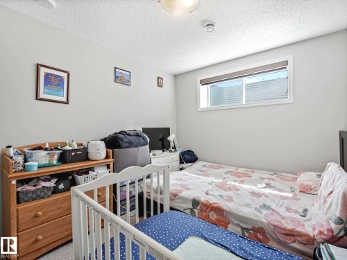 Room featuring light-toned walls and a textured ceiling - 2435 12 Avenue, Edmonton, AB - Indoor Photo Showing Bedroom