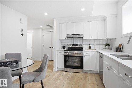 9705 68 Avenue, Edmonton, AB - Indoor Photo Showing Kitchen With Double Sink