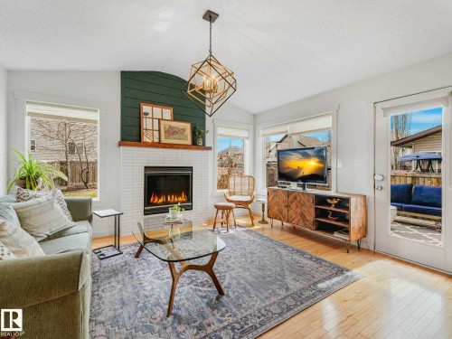 6129 Stinson Way, Edmonton, AB - Indoor Photo Showing Living Room With Fireplace