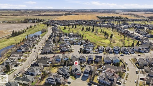 Aerial perspective showcasing a residential neighborhood with varied architectural styles - 5 Richelieu Place, Beaumont, AB - Outdoor With View