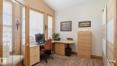 Dedicated room featuring a French door entry with glass paneling, multiple windows with blinds, and neutral-toned walls - 5 Richelieu Place, Beaumont, AB  - Indoor Photo Showing Office 