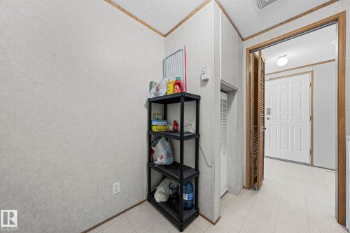 White paneled walls and wood-finish trim create a neutral palette - 623 Evergreen Park, Edmonton, AB - Indoor Photo Showing Other Room