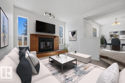 54 4403 Riverbend Road, Edmonton, AB - Indoor Photo Showing Living Room With Fireplace