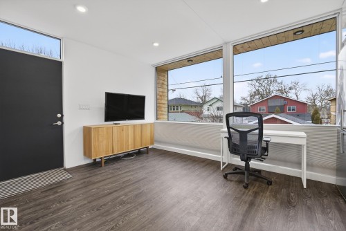 The interior features hardwood flooring and recessed lighting - 9736 78 Avenue, Edmonton, AB - Indoor