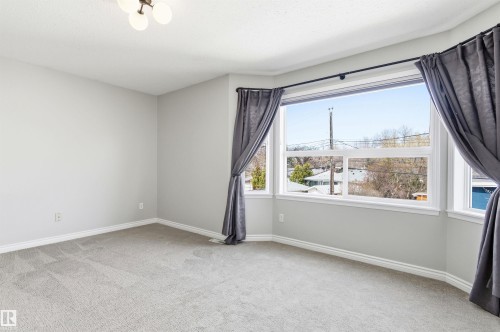 Bay window featuring multiple panes and a white trim - 8730 92A Avenue, Edmonton, AB - Indoor Photo Showing Other Room