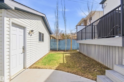 Detached auxiliary building with white vinyl siding - 8730 92A Avenue, Edmonton, AB - Outdoor With Exterior