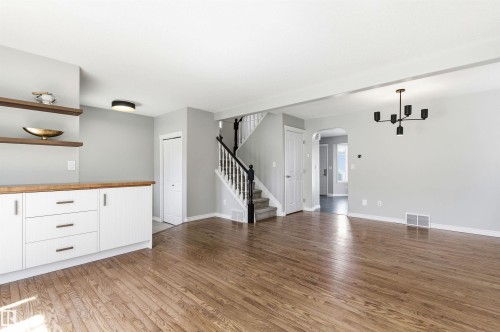 Open concept living area featuring hardwood flooring - 8730 92A Avenue, Edmonton, AB - Indoor