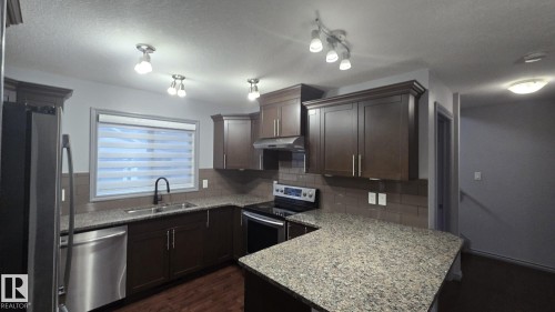 3617 Weidle Bend Bend, Edmonton, AB - Indoor Photo Showing Kitchen With Double Sink With Upgraded Kitchen
