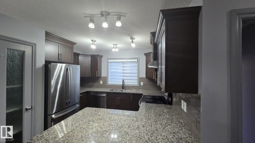 3617 Weidle Bend Bend, Edmonton, AB - Indoor Photo Showing Kitchen With Double Sink
