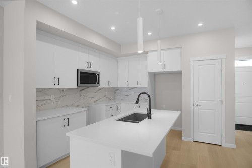 7002 50A Avenue, Beaumont, AB - Indoor Photo Showing Kitchen With Double Sink With Upgraded Kitchen