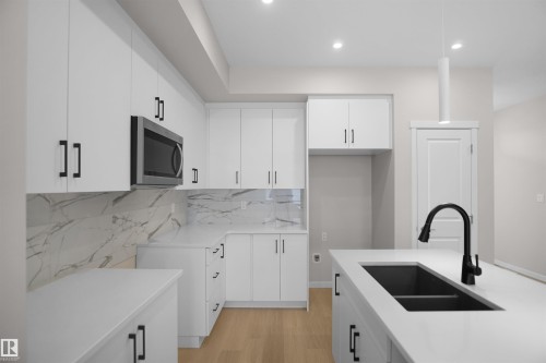 7002 50A Avenue, Beaumont, AB - Indoor Photo Showing Kitchen With Double Sink