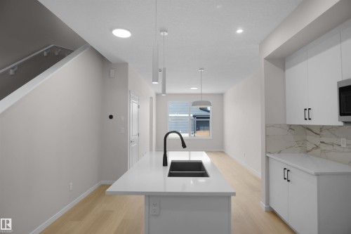 7002 50A Avenue, Beaumont, AB - Indoor Photo Showing Kitchen With Double Sink