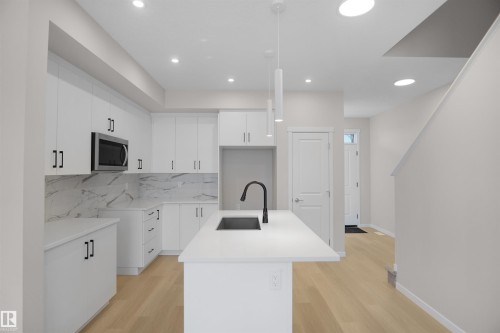 7002 50A Avenue, Beaumont, AB - Indoor Photo Showing Kitchen With Upgraded Kitchen