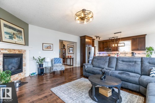 357 Simpkins Wynd, Leduc, AB - Indoor Photo Showing Living Room With Fireplace