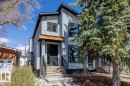 Contemporary two-story exterior featuring a gray stucco finish and corrugated metal accents - 8706 88 Avenue, Edmonton, AB  - Outdoor With Facade 