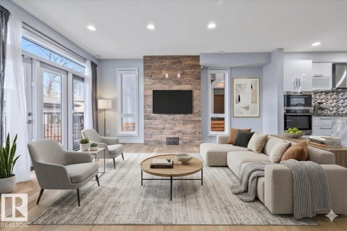 Open-concept living space featuring wood-finish flooring and recessed lighting - 8706 88 Avenue, Edmonton, AB - Indoor Photo Showing Living Room With Fireplace