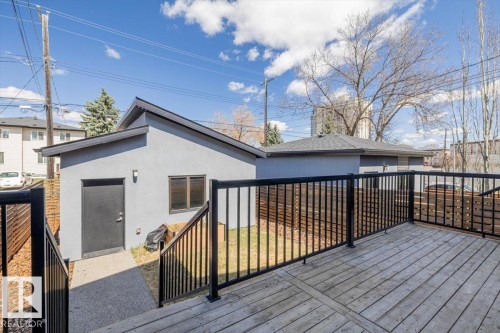 Exterior decking with black metal railings - 8706 88 Avenue, Edmonton, AB - Outdoor With Deck Patio Veranda With Exterior