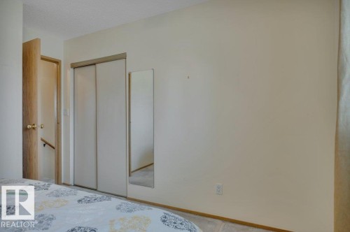 Sliding closet doors provide ample storage space - 18227 76 Avenue, Edmonton, AB - Indoor