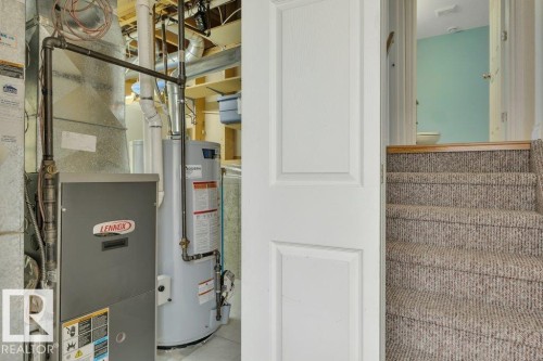 Utility area featuring a Lennox furnace and a hot water heater - 18227 76 Avenue, Edmonton, AB - Indoor Photo Showing Basement