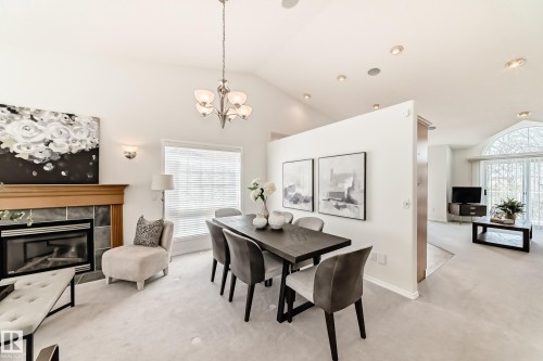 38 920 119 Street, Edmonton, AB - Indoor Photo Showing Dining Room With Fireplace