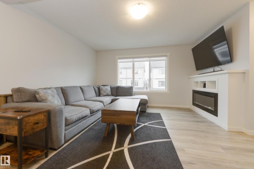 19620 27 Avenue, Edmonton, AB - Indoor Photo Showing Living Room With Fireplace