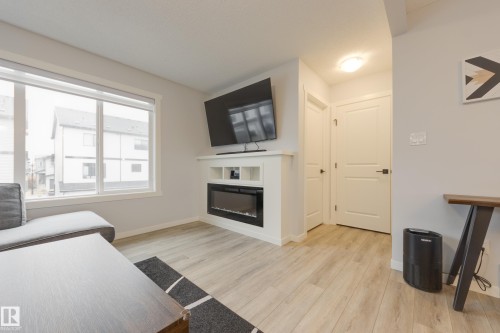 19620 27 Avenue, Edmonton, AB - Indoor Photo Showing Living Room With Fireplace