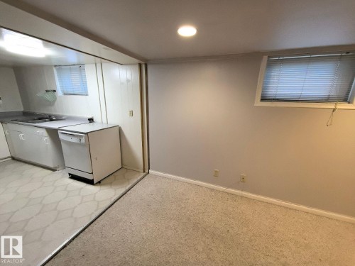 Dedicated room featuring a wall-mounted window, recessed lighting, and carpet flooring - 10815 68 Avenue, Edmonton, AB - Indoor