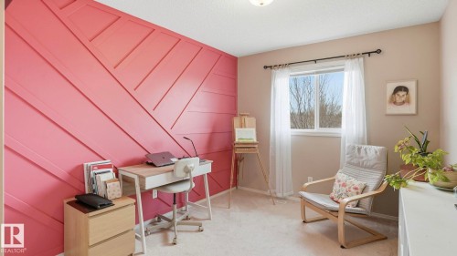 Accent wall featuring geometric paneling - 80 287 Macewan Road, Edmonton, AB - Indoor