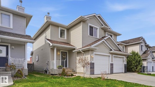 Two-story home with a light-toned siding exterior - 80 287 Macewan Road, Edmonton, AB - Outdoor With Facade