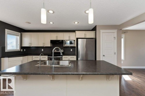 2146 Trumpeter Way, Edmonton, AB - Indoor Photo Showing Kitchen With Double Sink